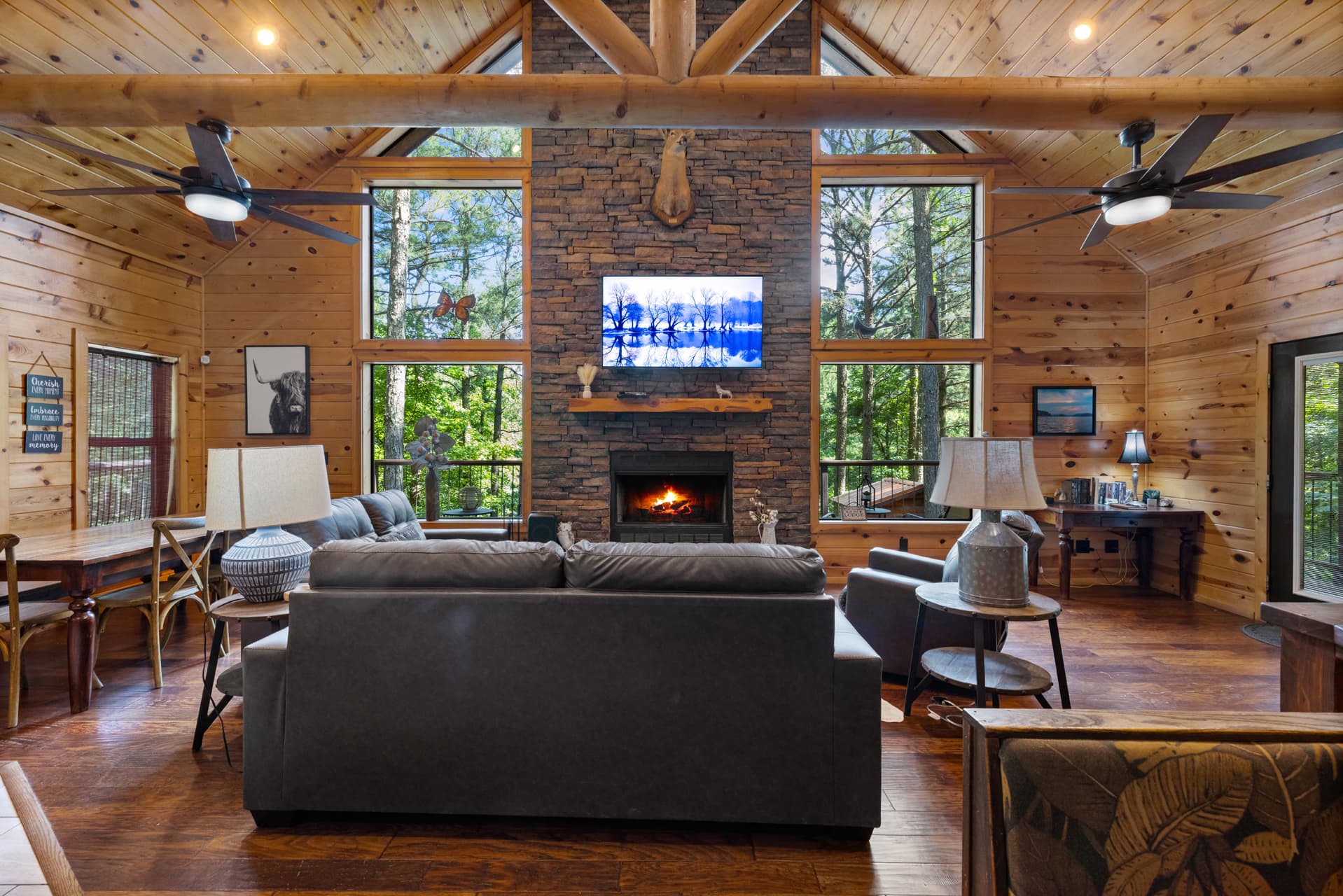 Main floor, log wooden beams across ceiling, 2 fans