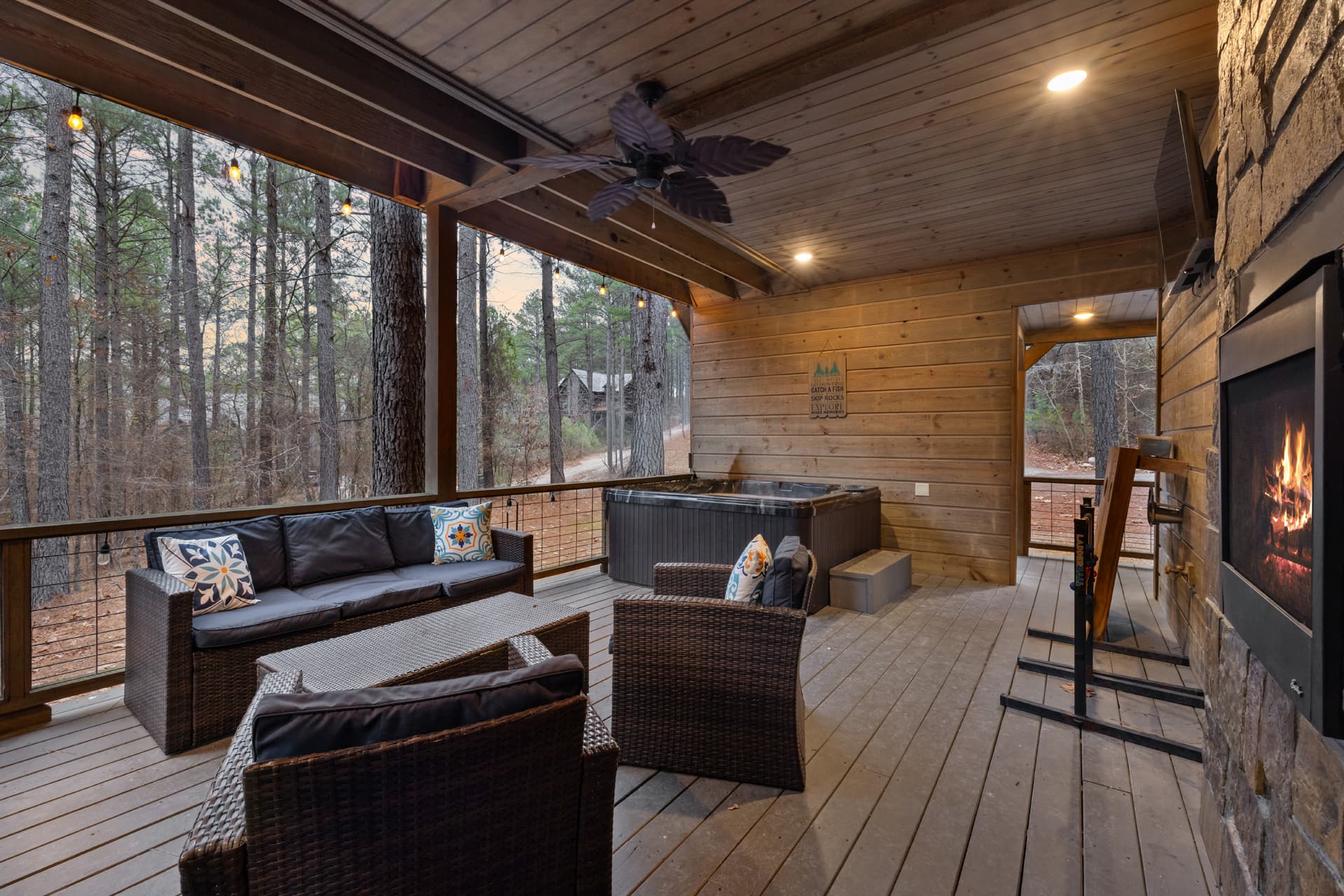 Covered patio with hot tub and couch