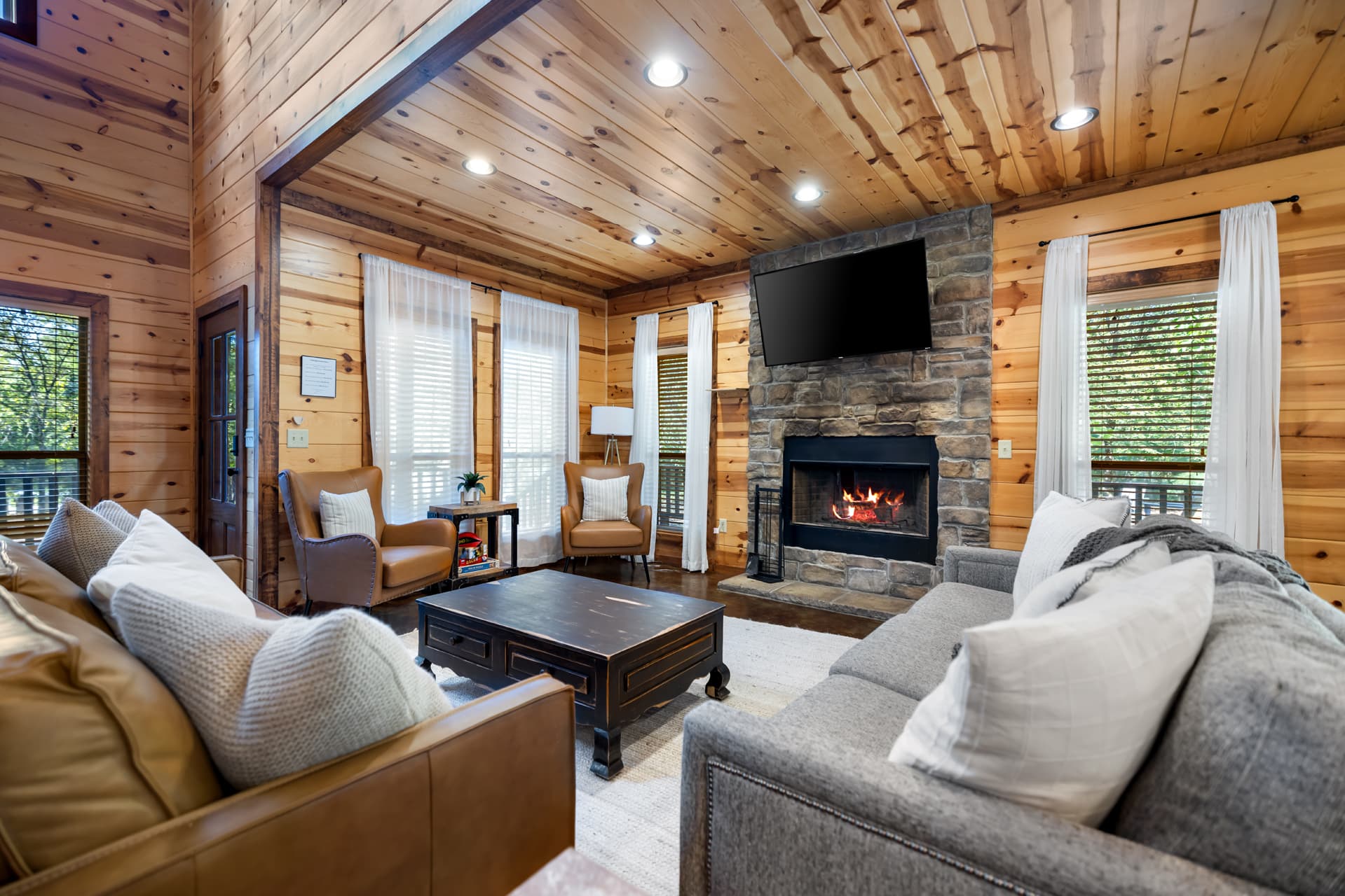 Living room couches, coffee table and fireplace