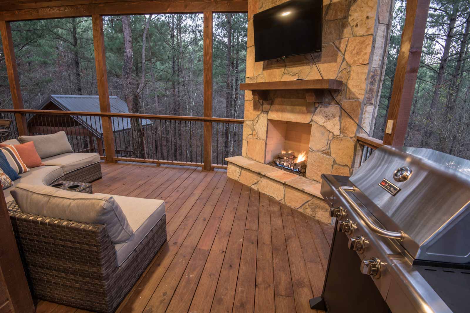 Covered back porch fireplace, grill, and seating