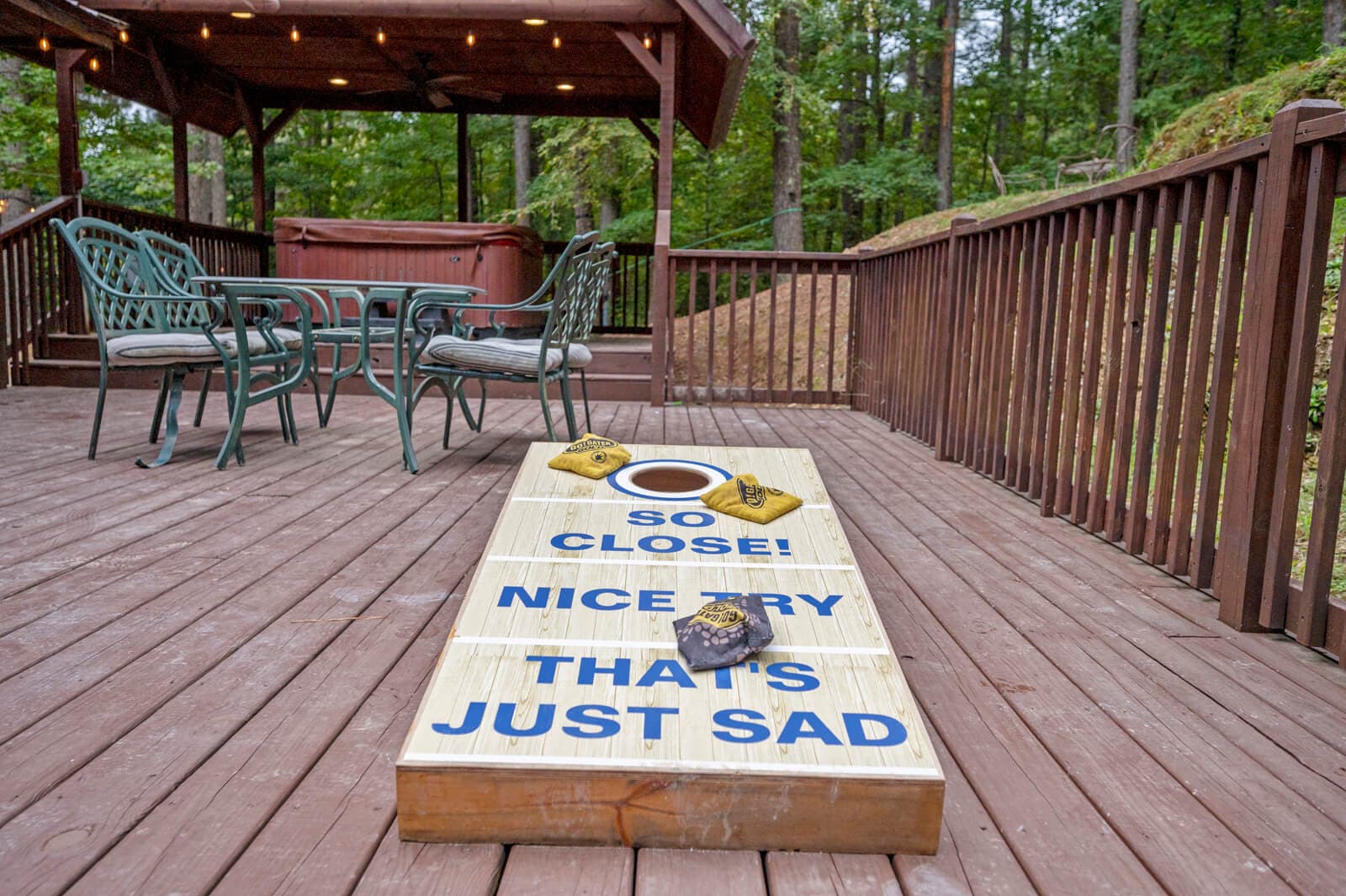 Corn hole game on large back deck