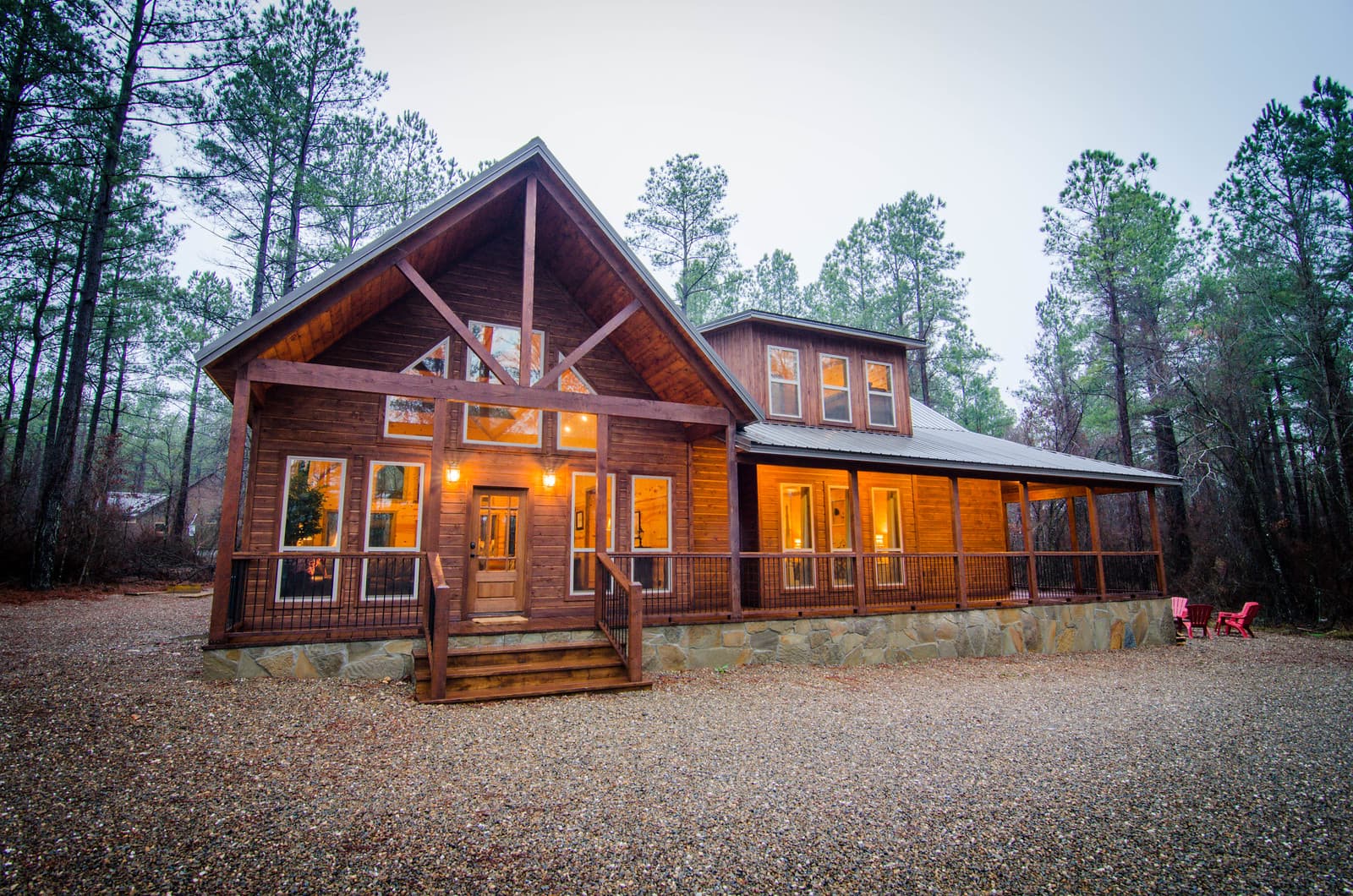 2 story log cabin, large gravel driveway