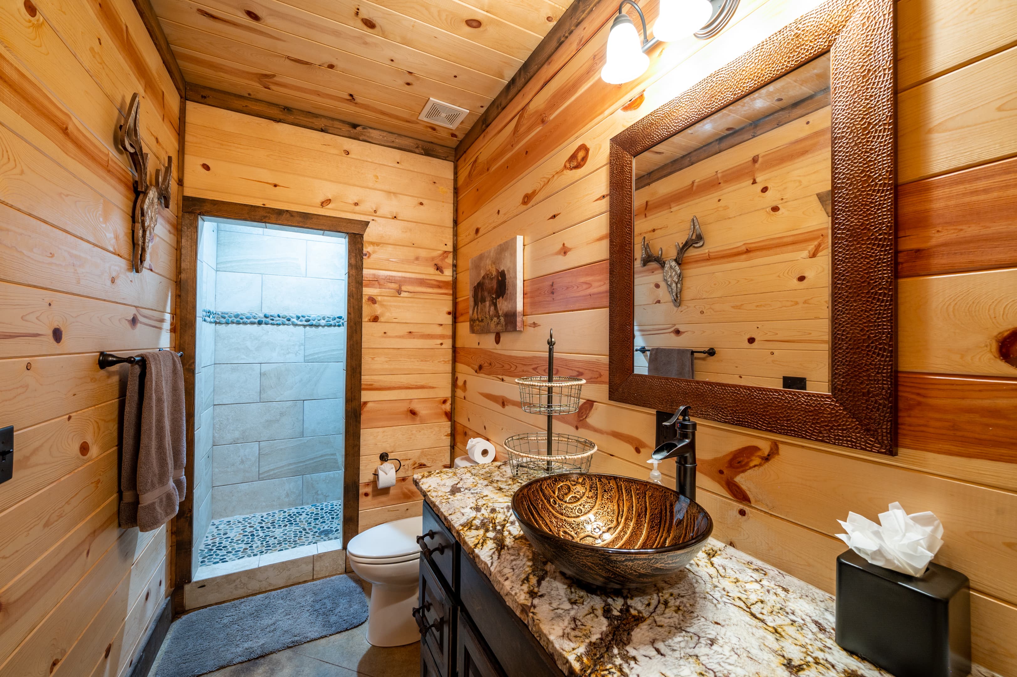 Walk in shower and modern copper bowl sink