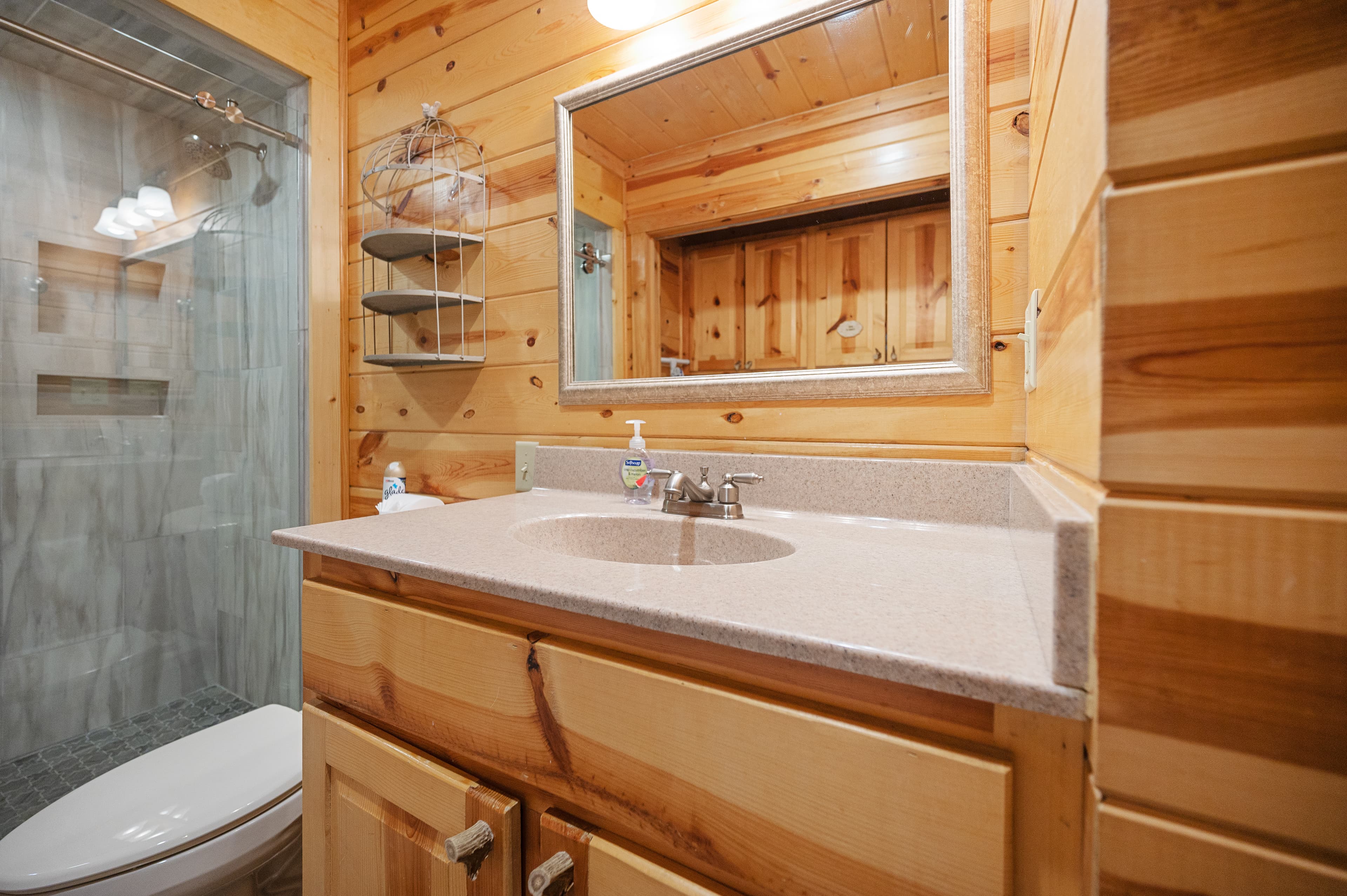 tile shower sink and toilet in full bathroom