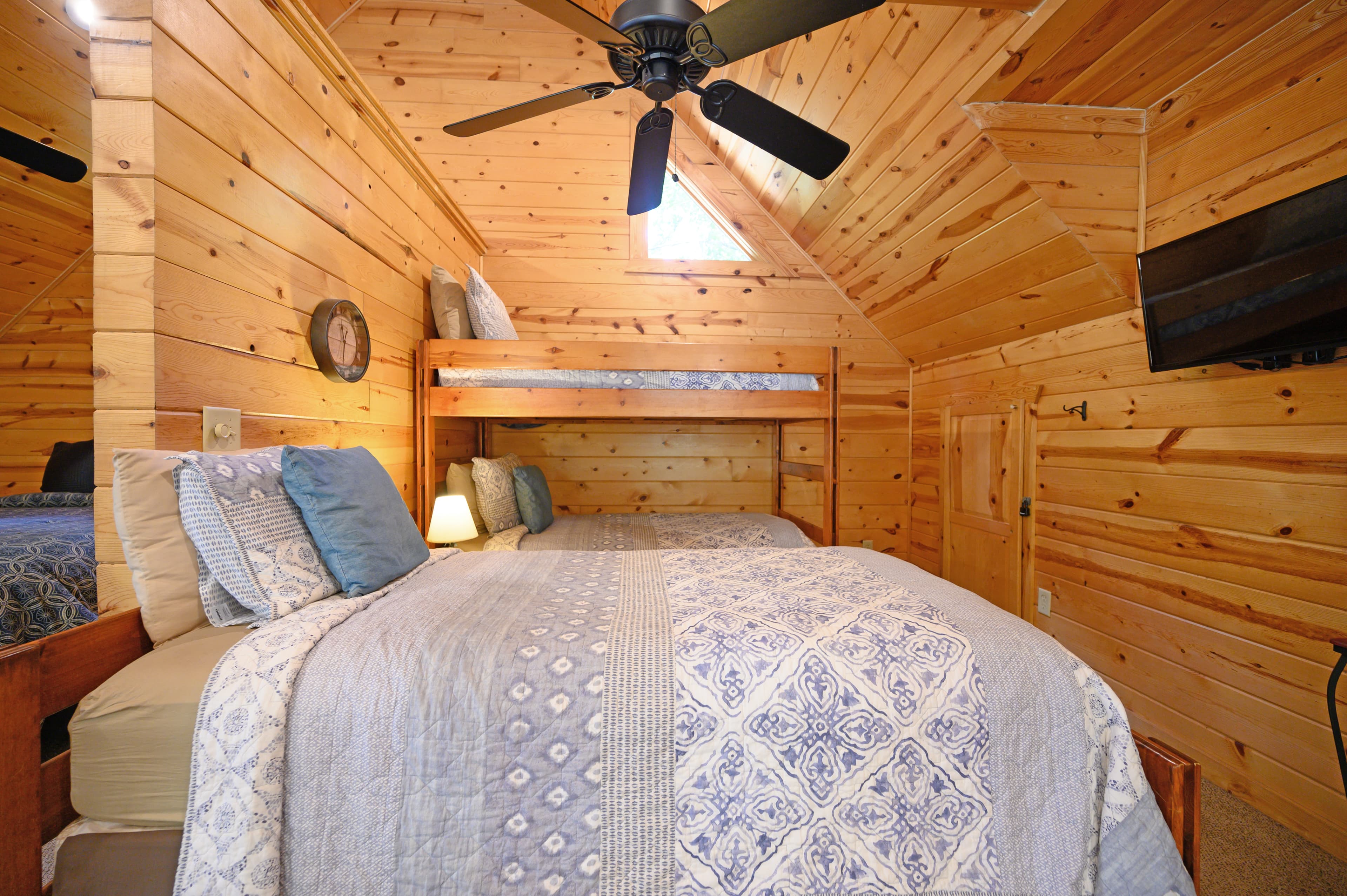 bed and tv in open loft