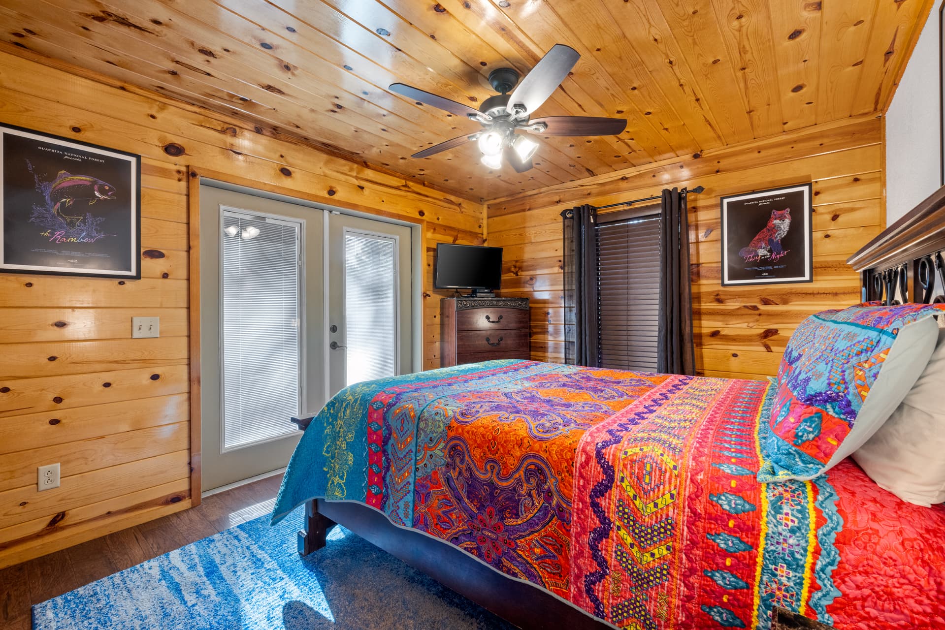 Front 2nd queen bedroom with side tables, dresser and TV
