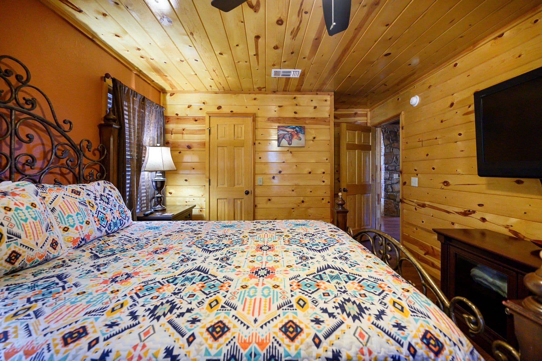 Queen bedroom with TV