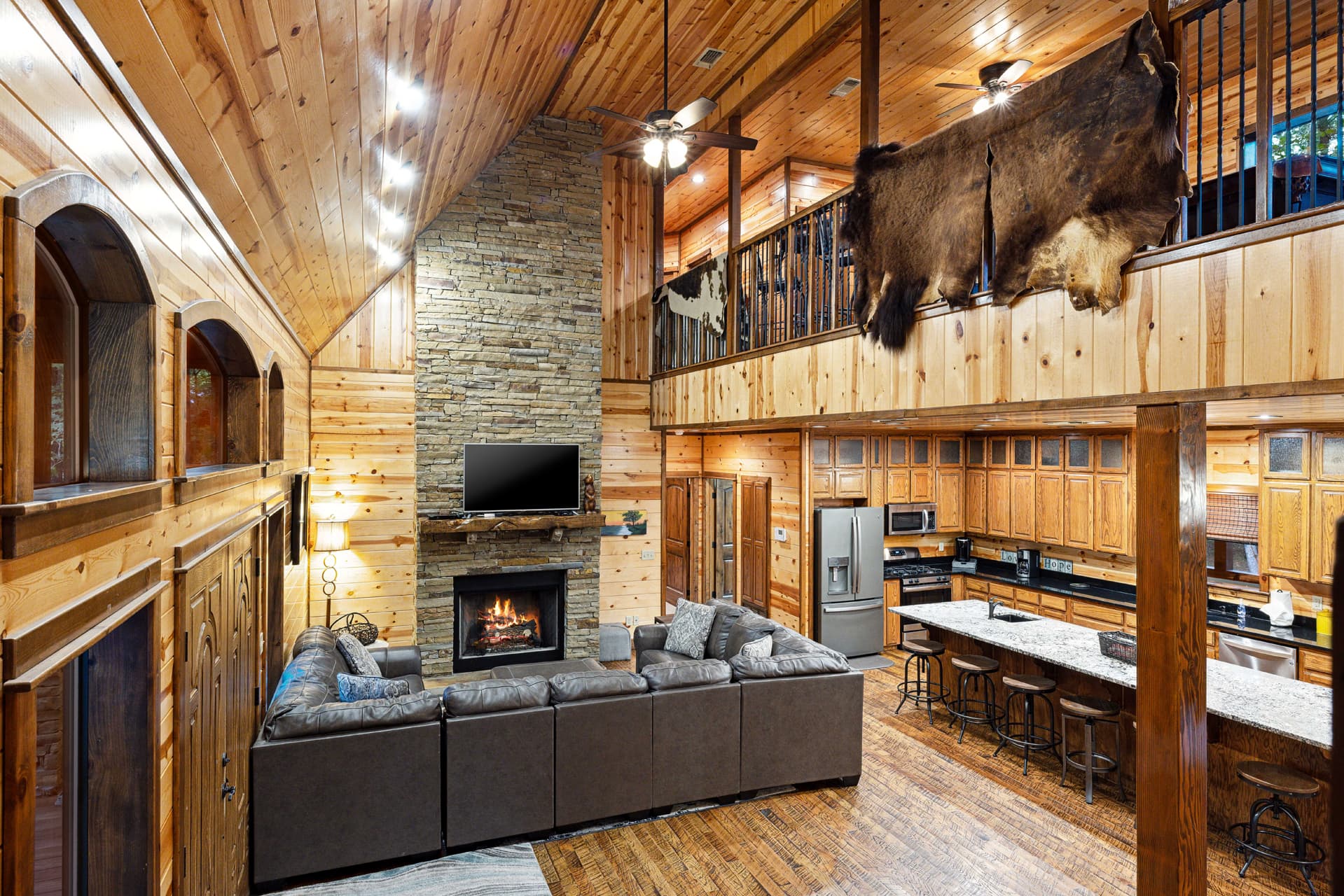 open 1st living room, rock fireplace