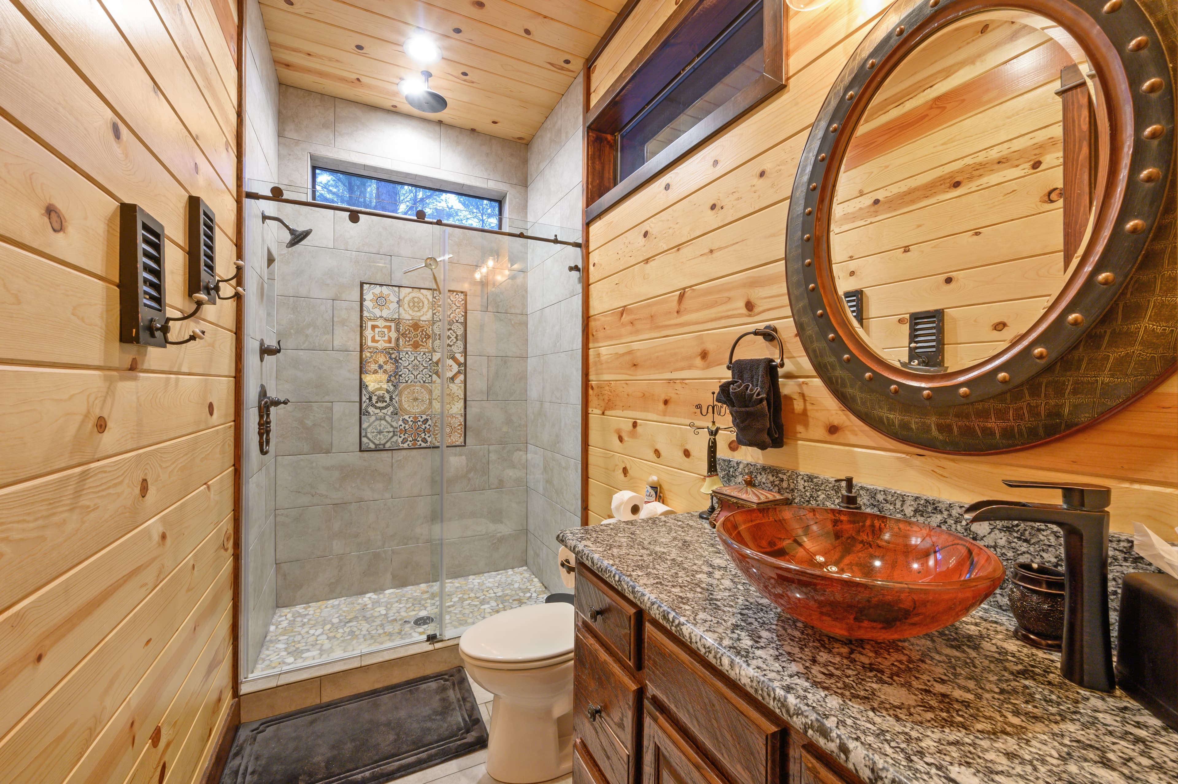 full bathroom with tile shower and modern sink