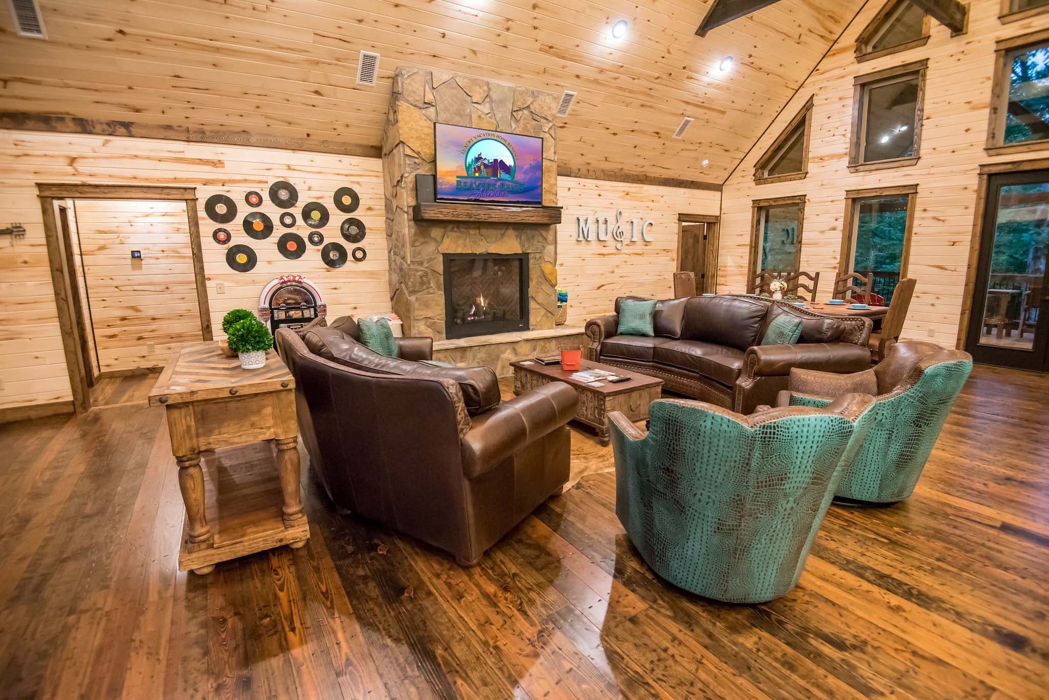 Open living area with a gas fireplace and a bluetooth speaker juxebox