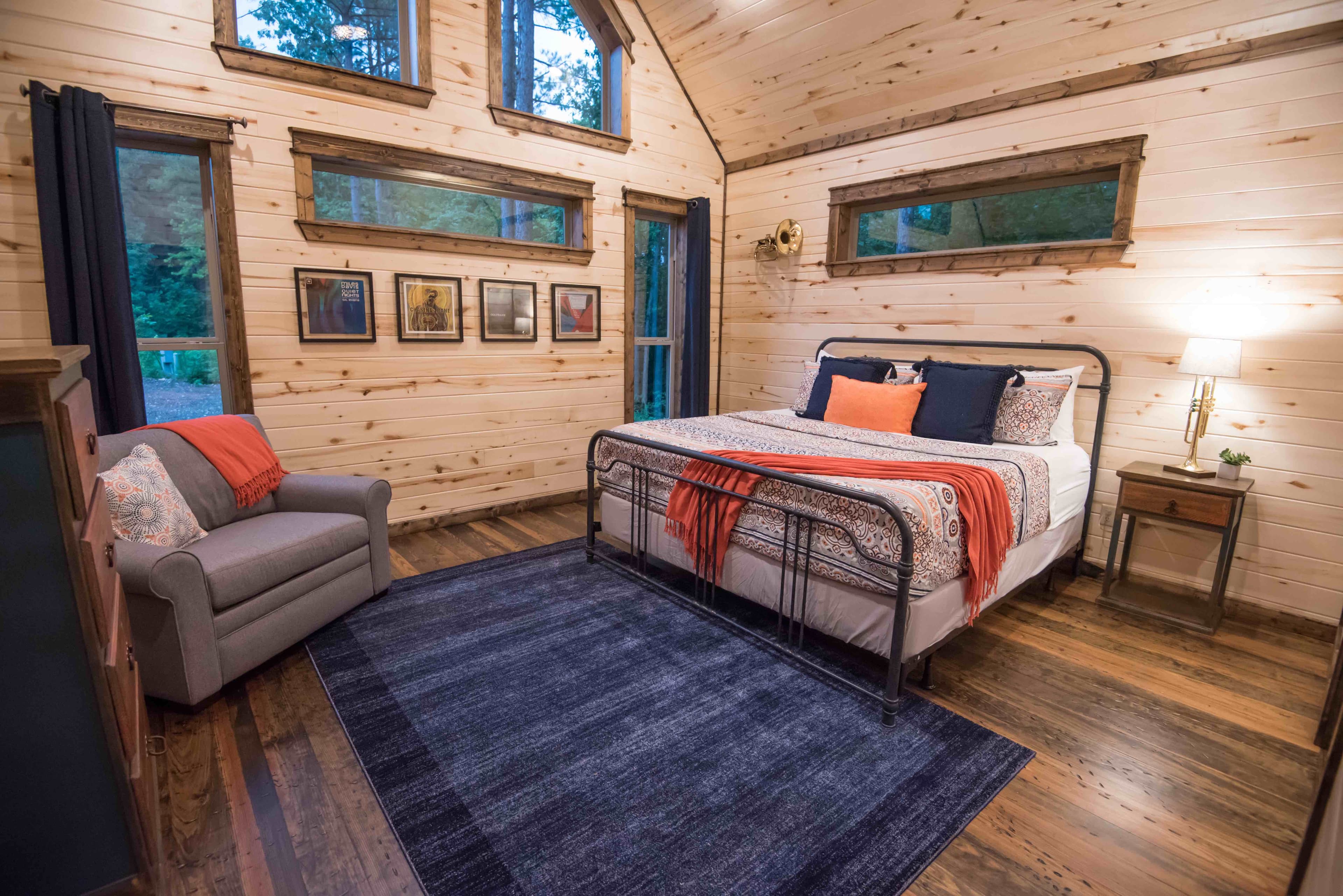 Front left king bedroom with chair, side table, and lamp