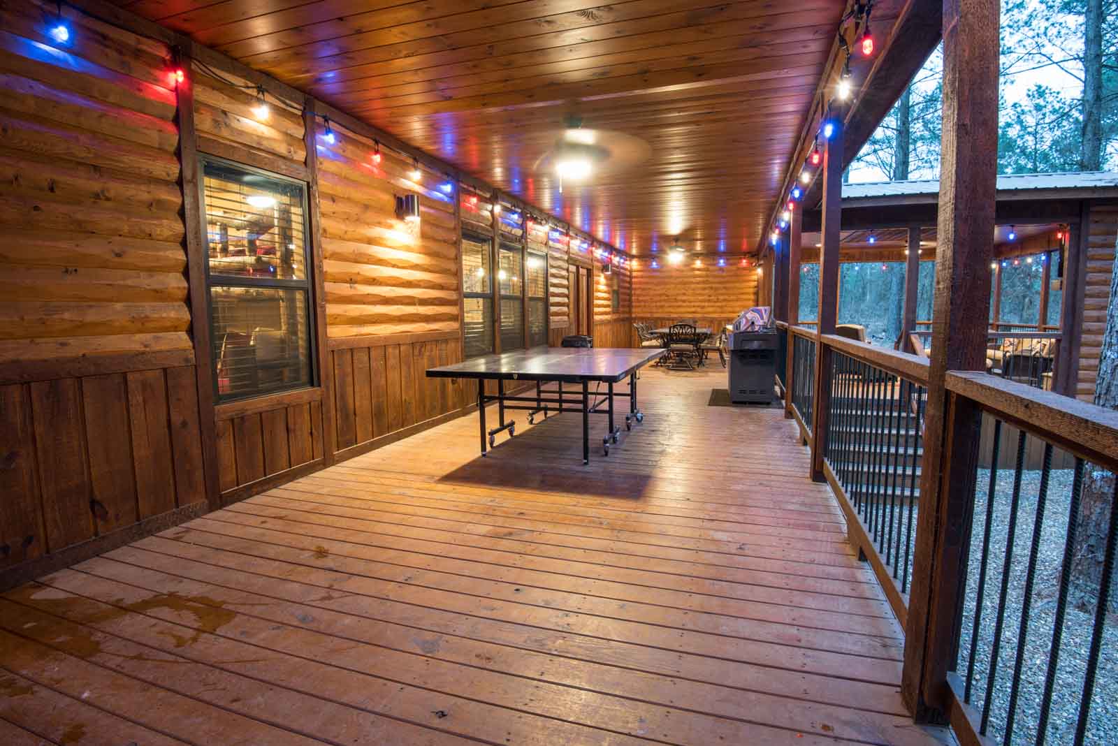 ping pong table on covered back wooden porch