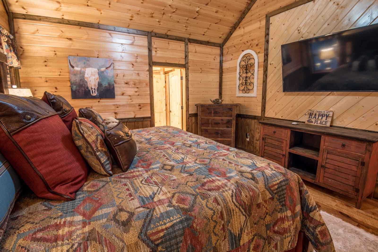 king bedroom with tv and dresser