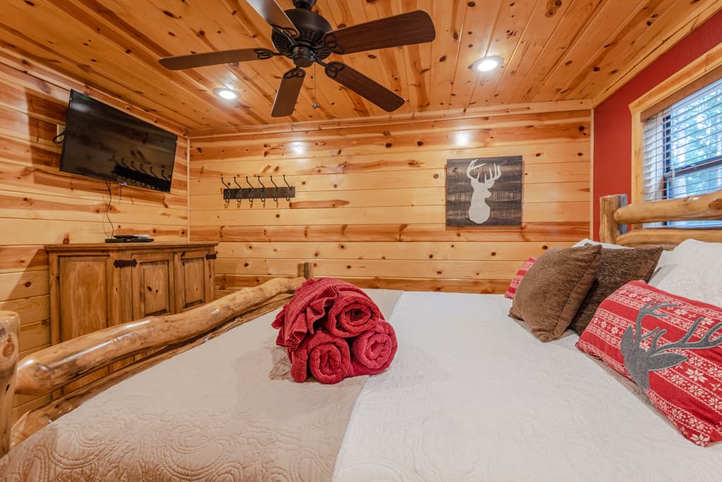 King bed with a TV and dresser