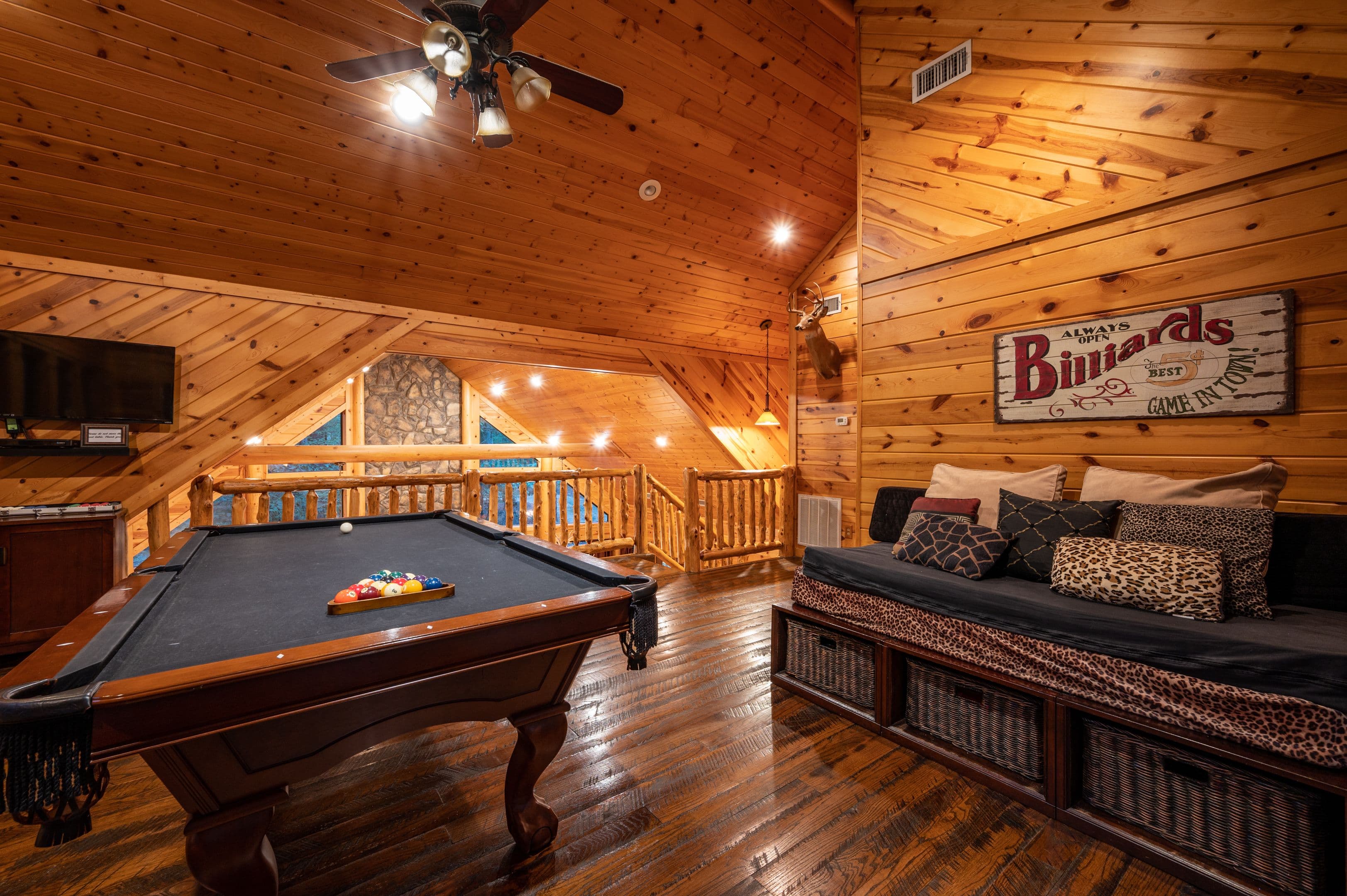 Pool table, tv, and seating