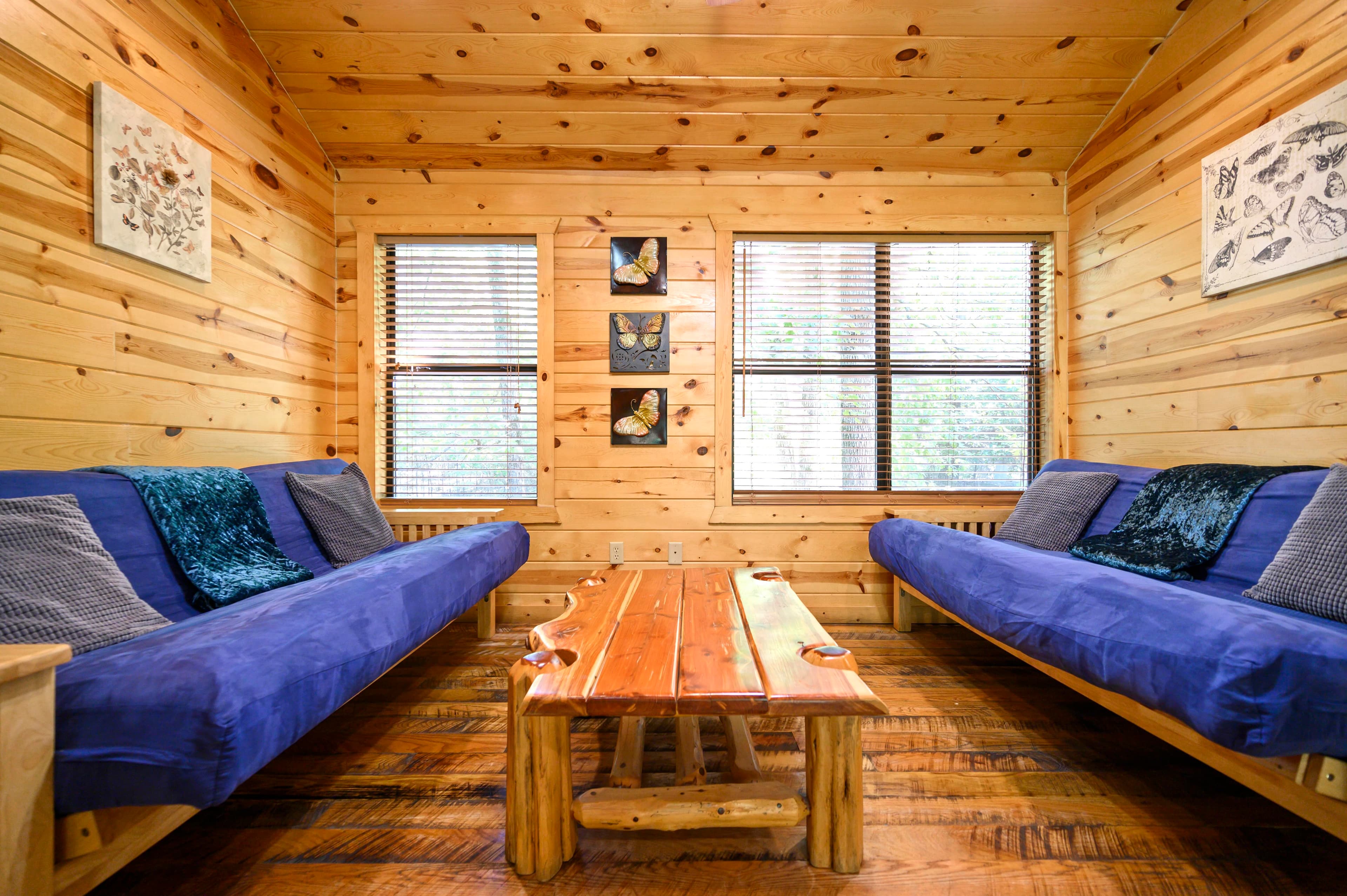 Upstairs king bedroom with couch, dresser, TV