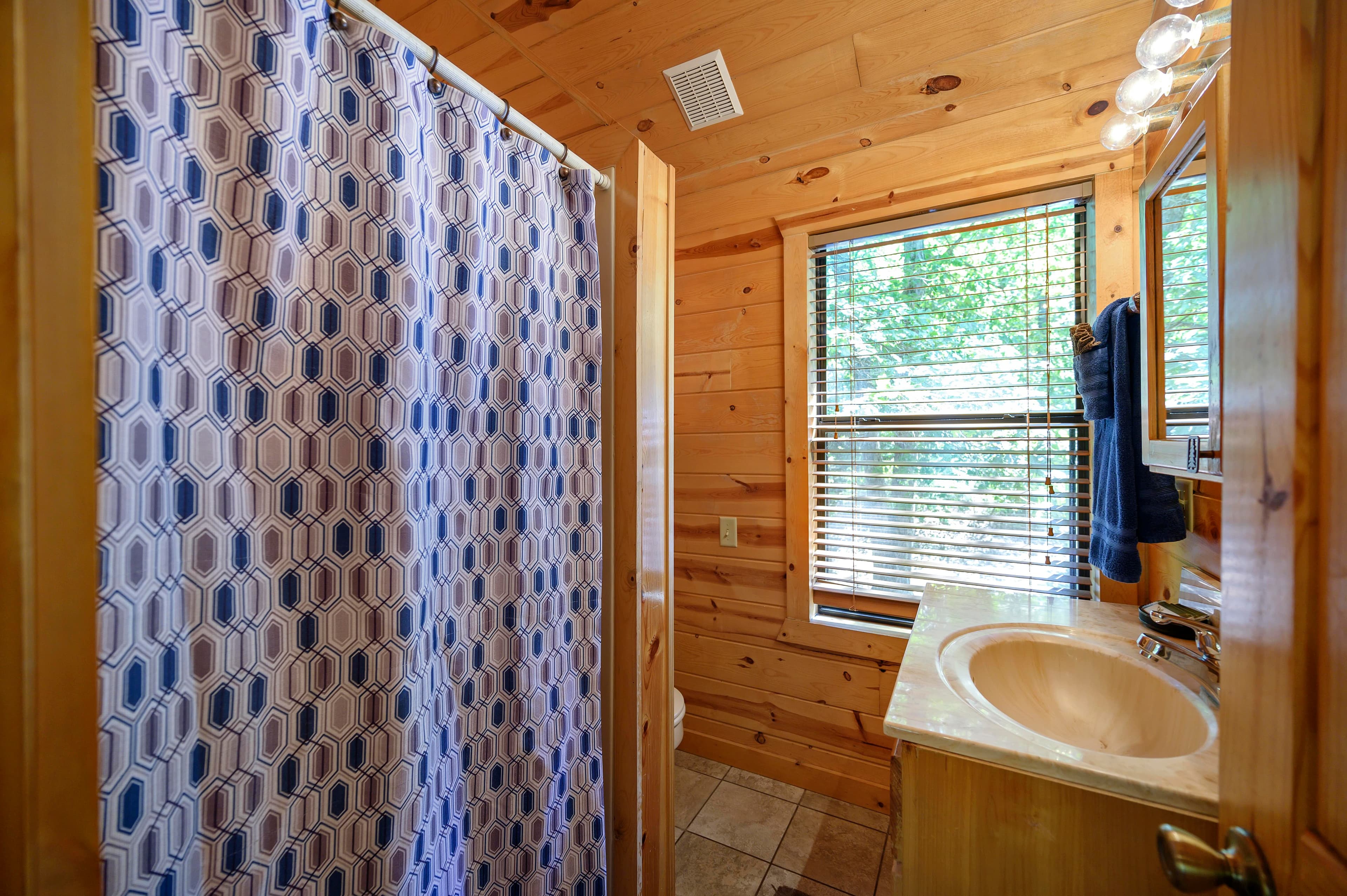Full bathroom with a shower/tub combo