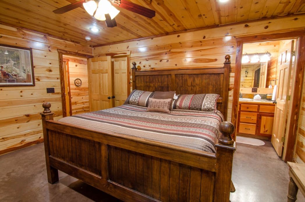 bed room with queen bed and set of bunk beds