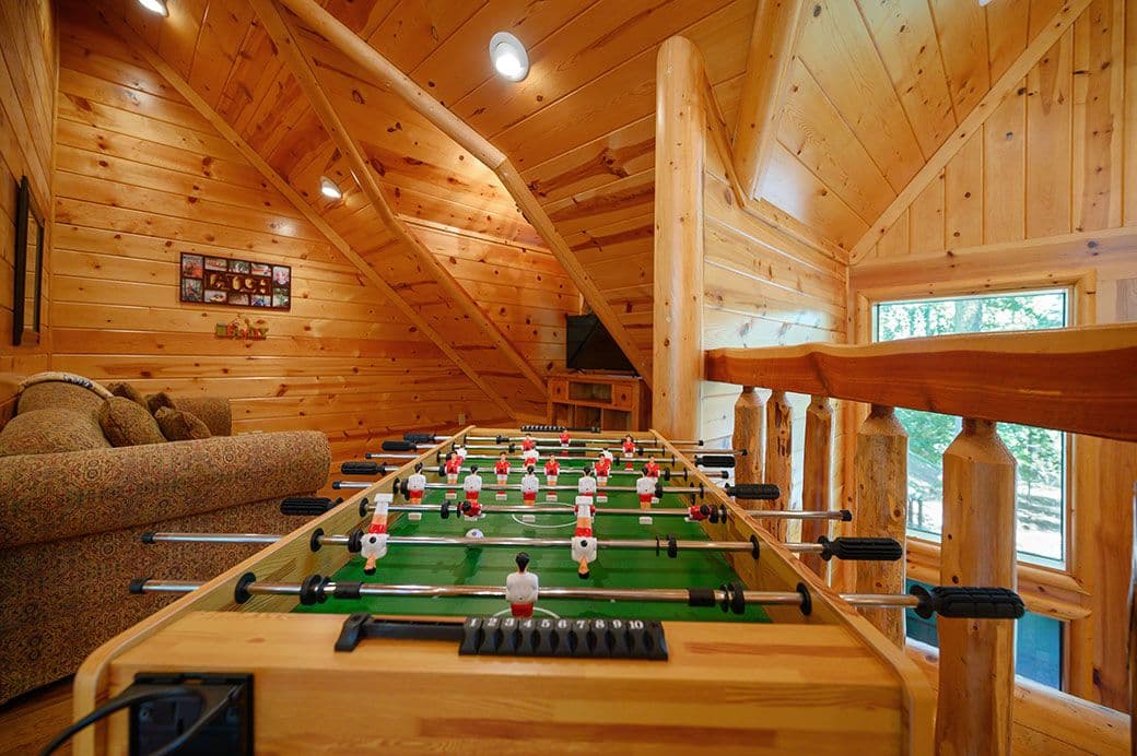 Upstairs loft with foosball game table