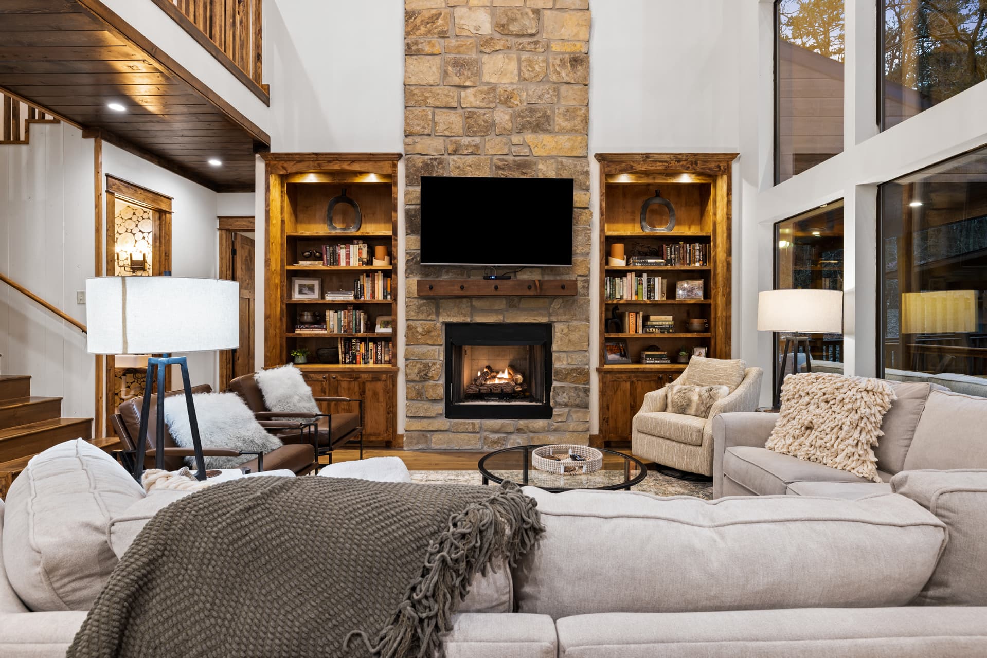 open living room with tv and bookshelves