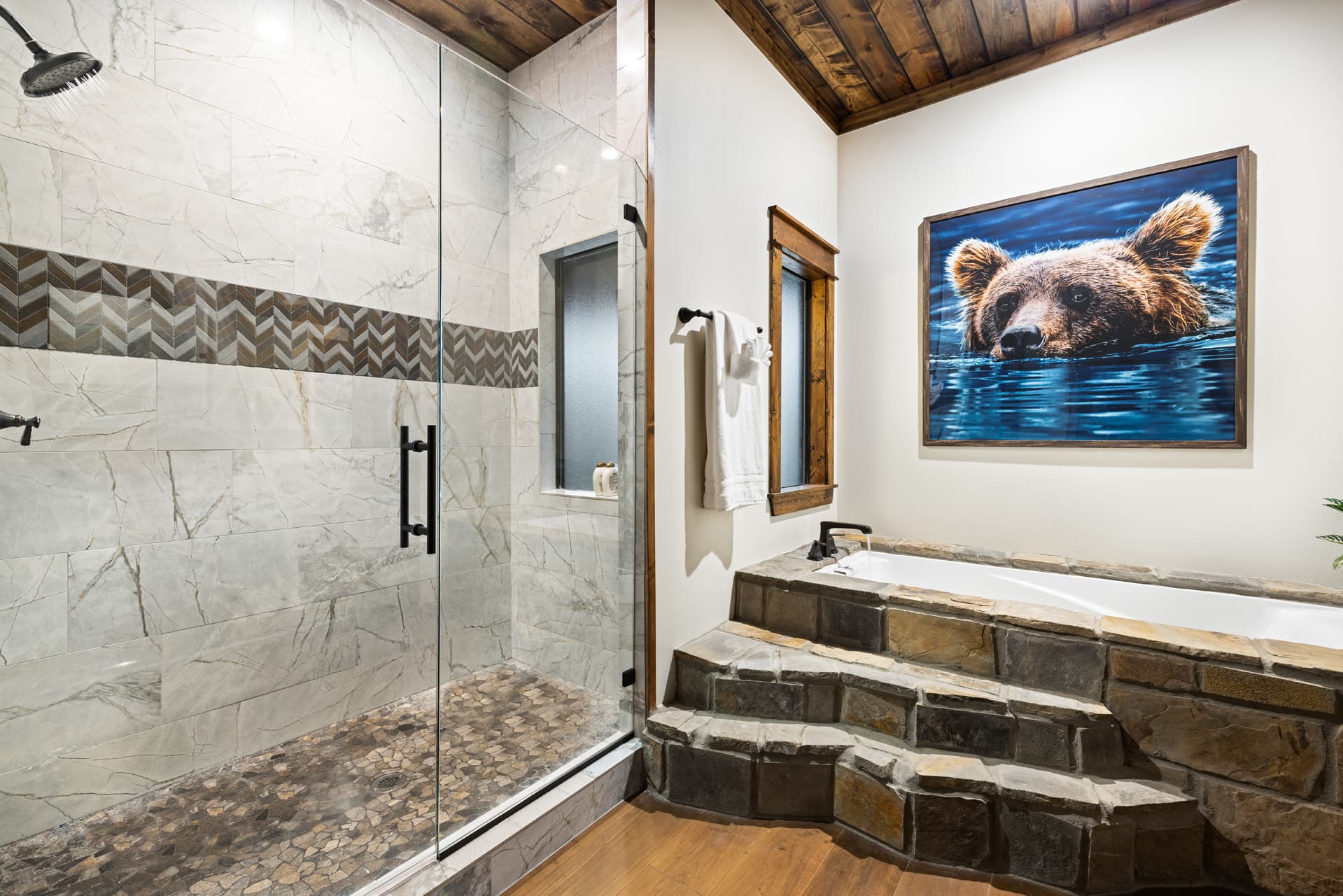 full bathroom, large tile and rock shower, rock bathtub