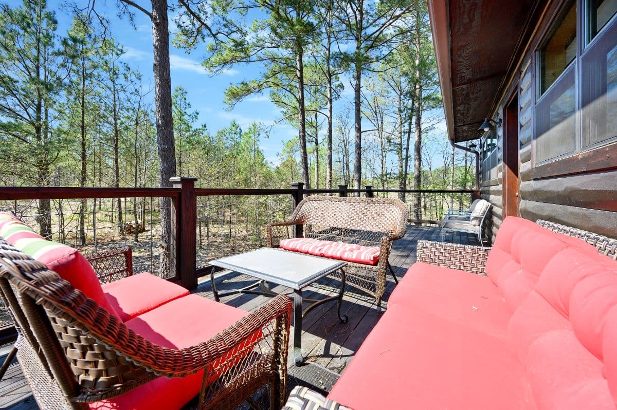 Upstairs porch with couches and table