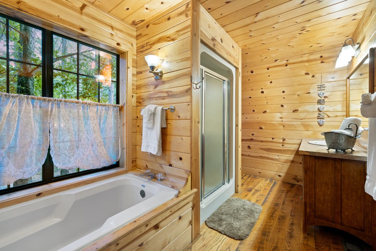Attached master bathroom w/ shower and tub