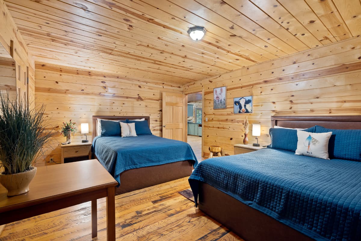 Beds and small table in 2nd downstairs bedroom