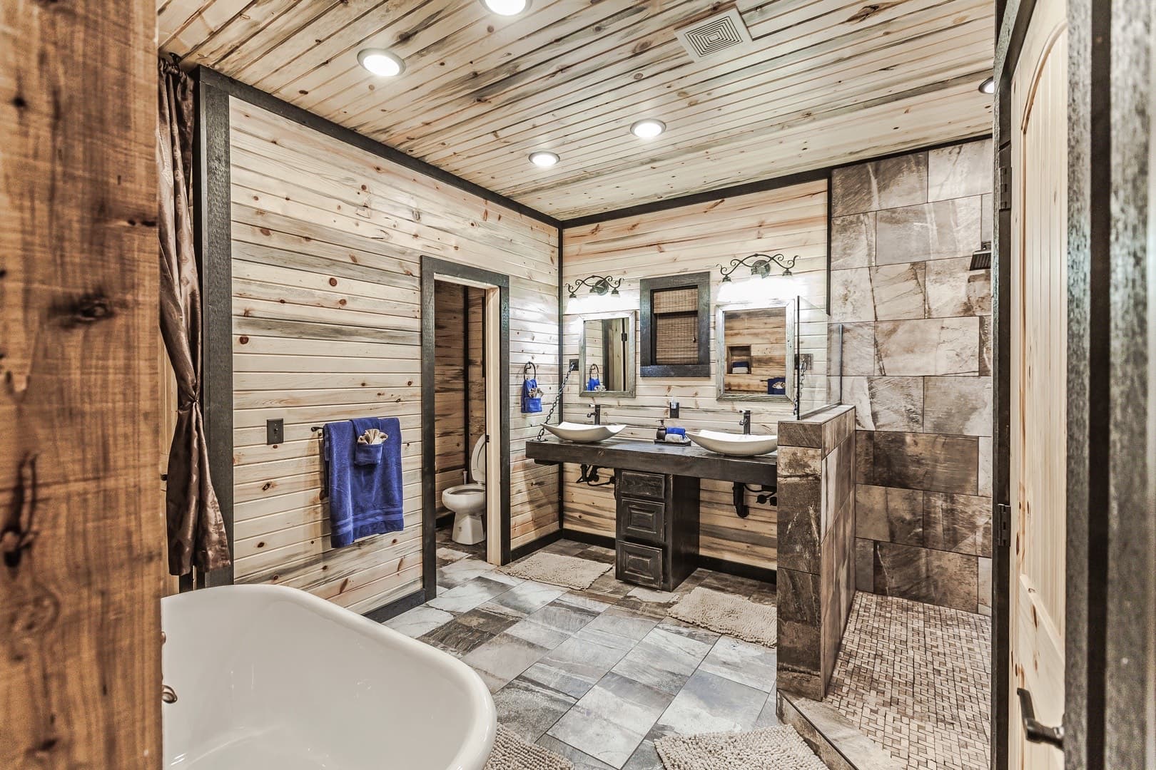 Bathroom with tub, shower, and sinks