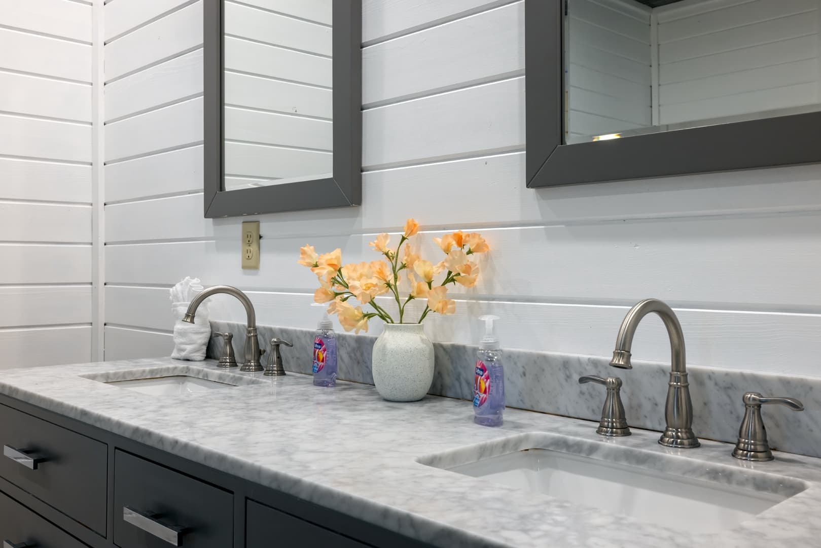 sinks and mirrors with liquid hand soaps