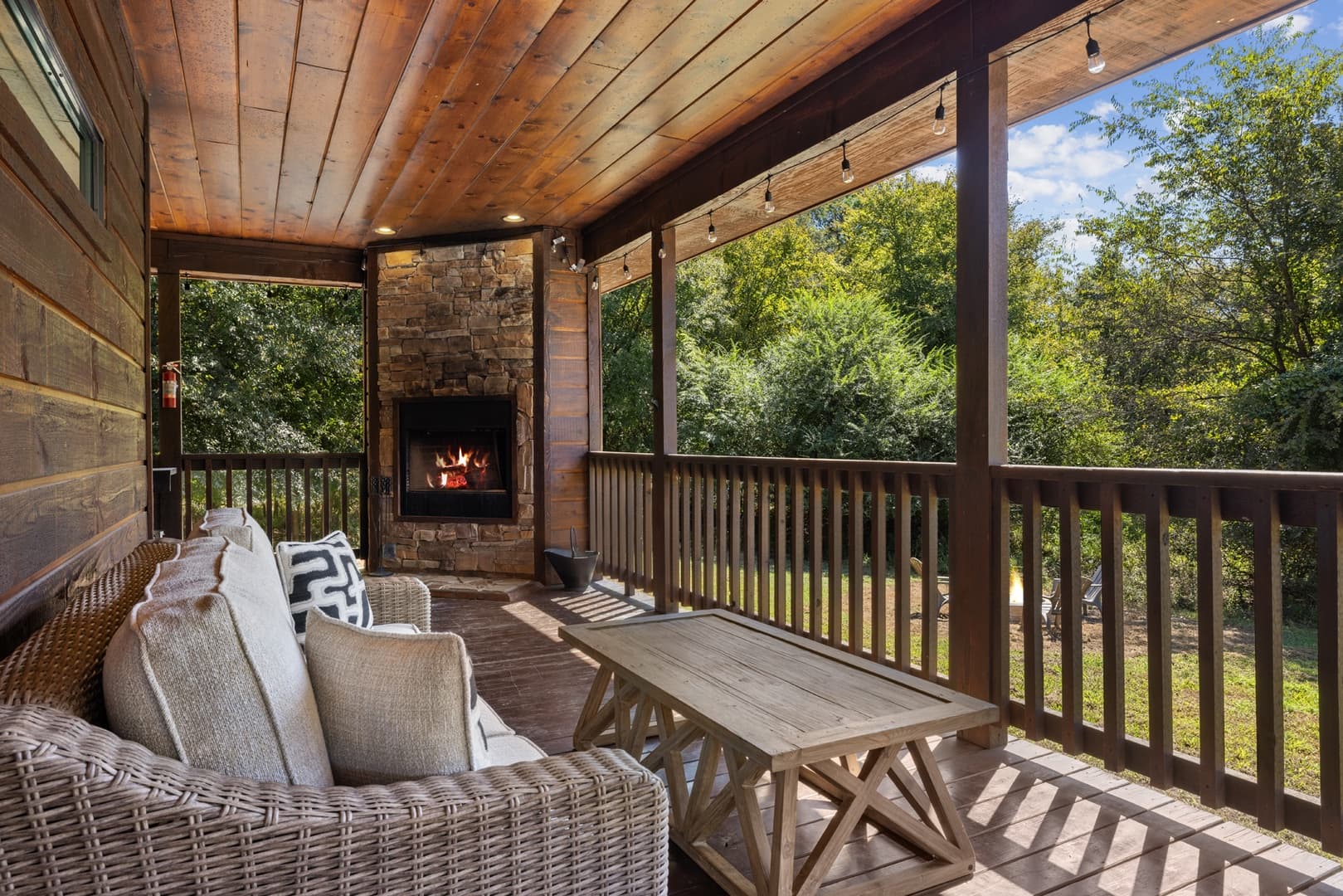 table with couch on covered porch