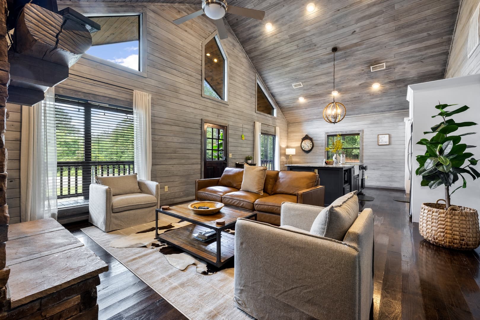Open modern living room couches, coffee table, and fireplace