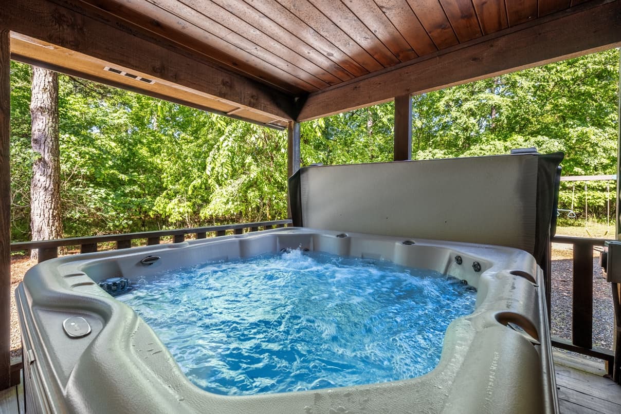 Large hot tub under covered patio