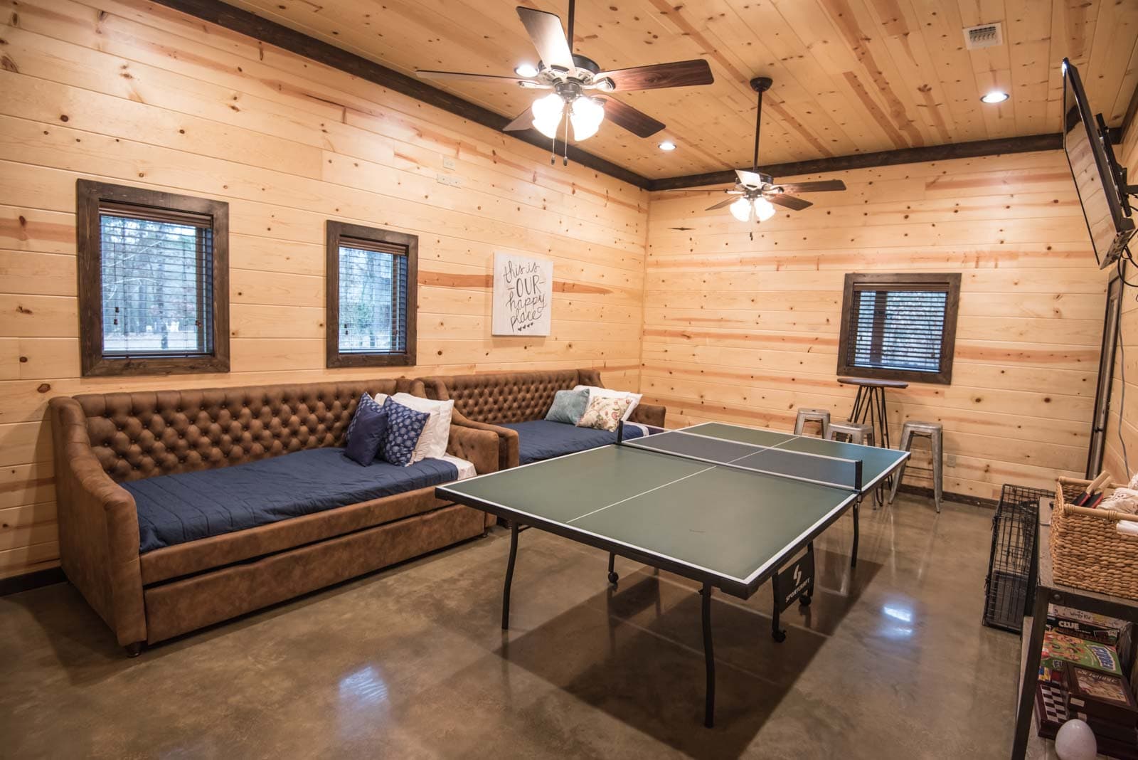 Game room with ping pong, beds, and TV