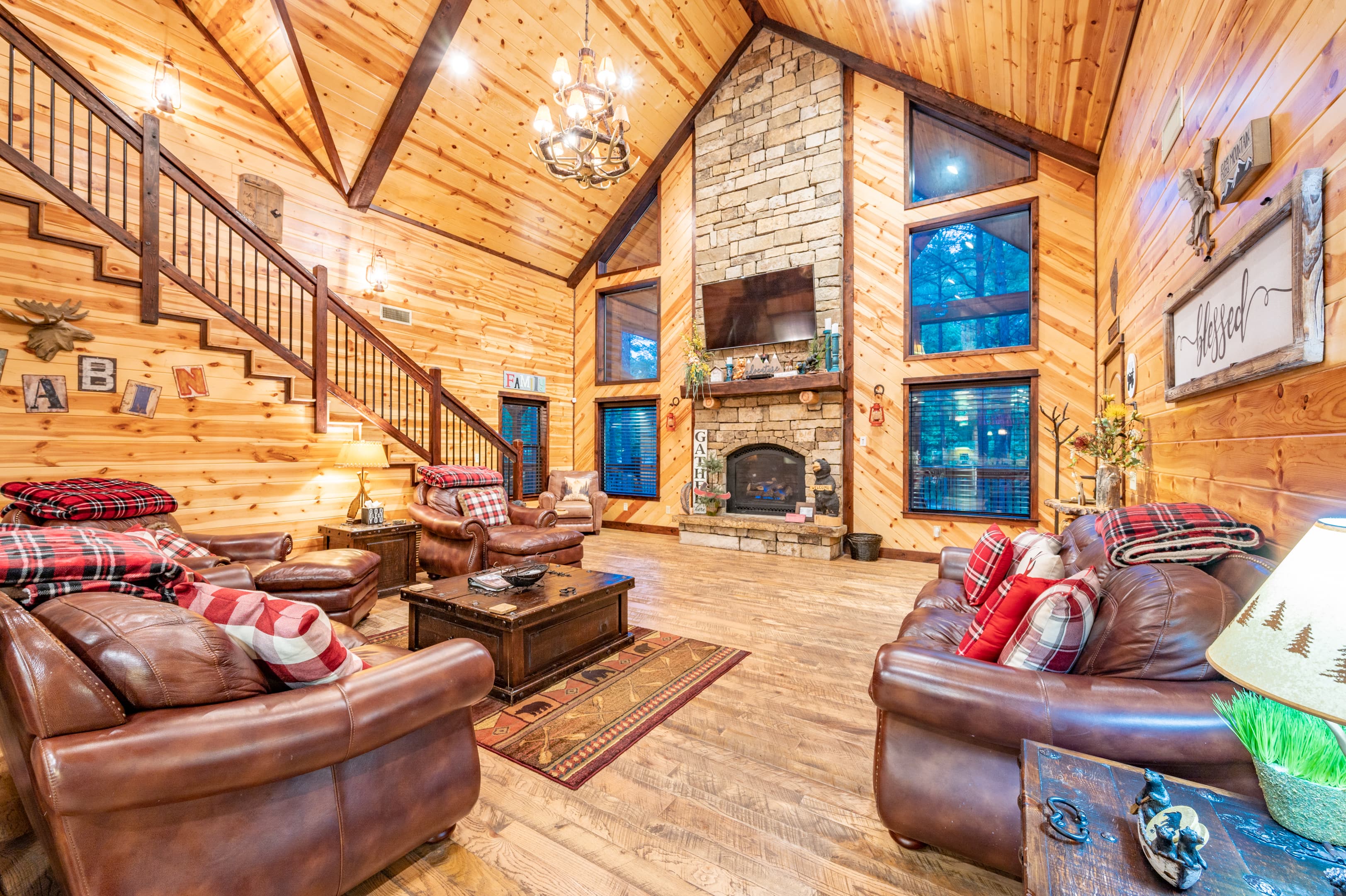 open living room, rock fireplace, tv