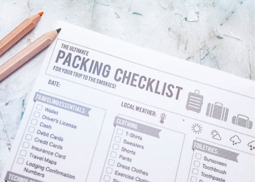 A printed packing checklist for a trip to the Smokies, with sections for travel essentials, clothing, toiletries, and local weather. A printed packing checklist for a trip to the Smokies, with sections for travel essentials, clothing, toiletries, and local weather.