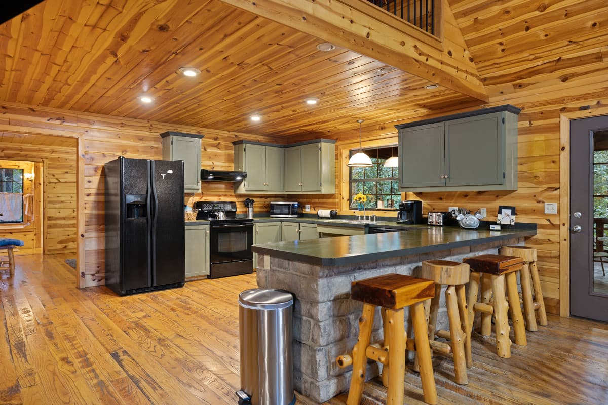 Island bar in kitchen with 4 stools