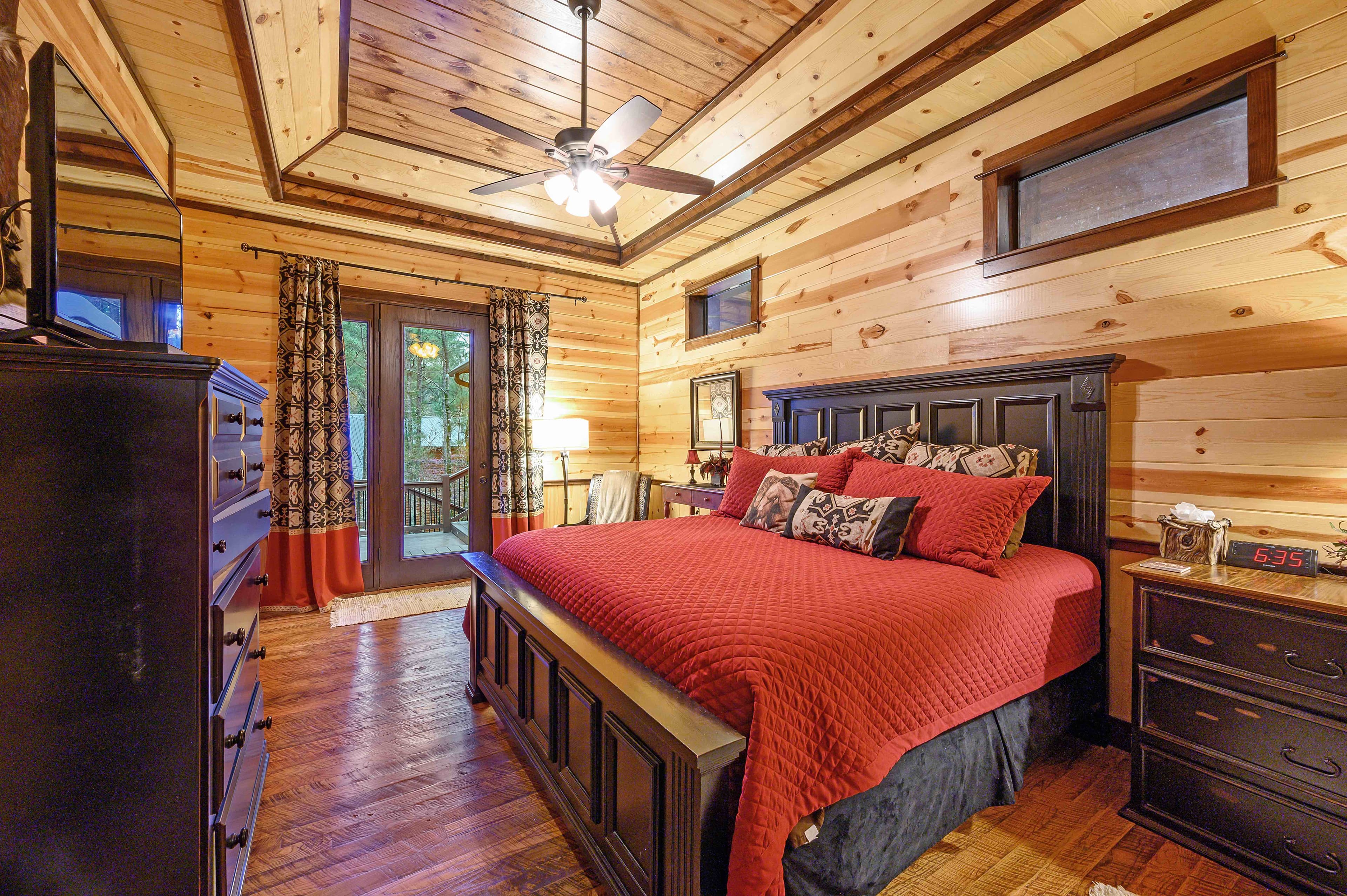 king bedroom with dresser and side tables
