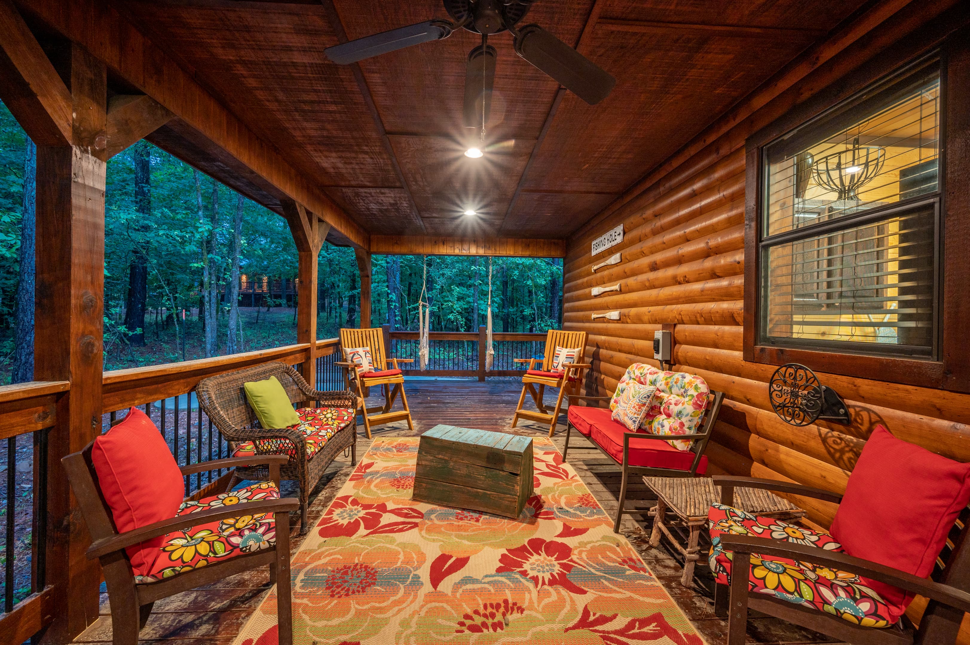 covered patio with seating near the outdoor gas firepit