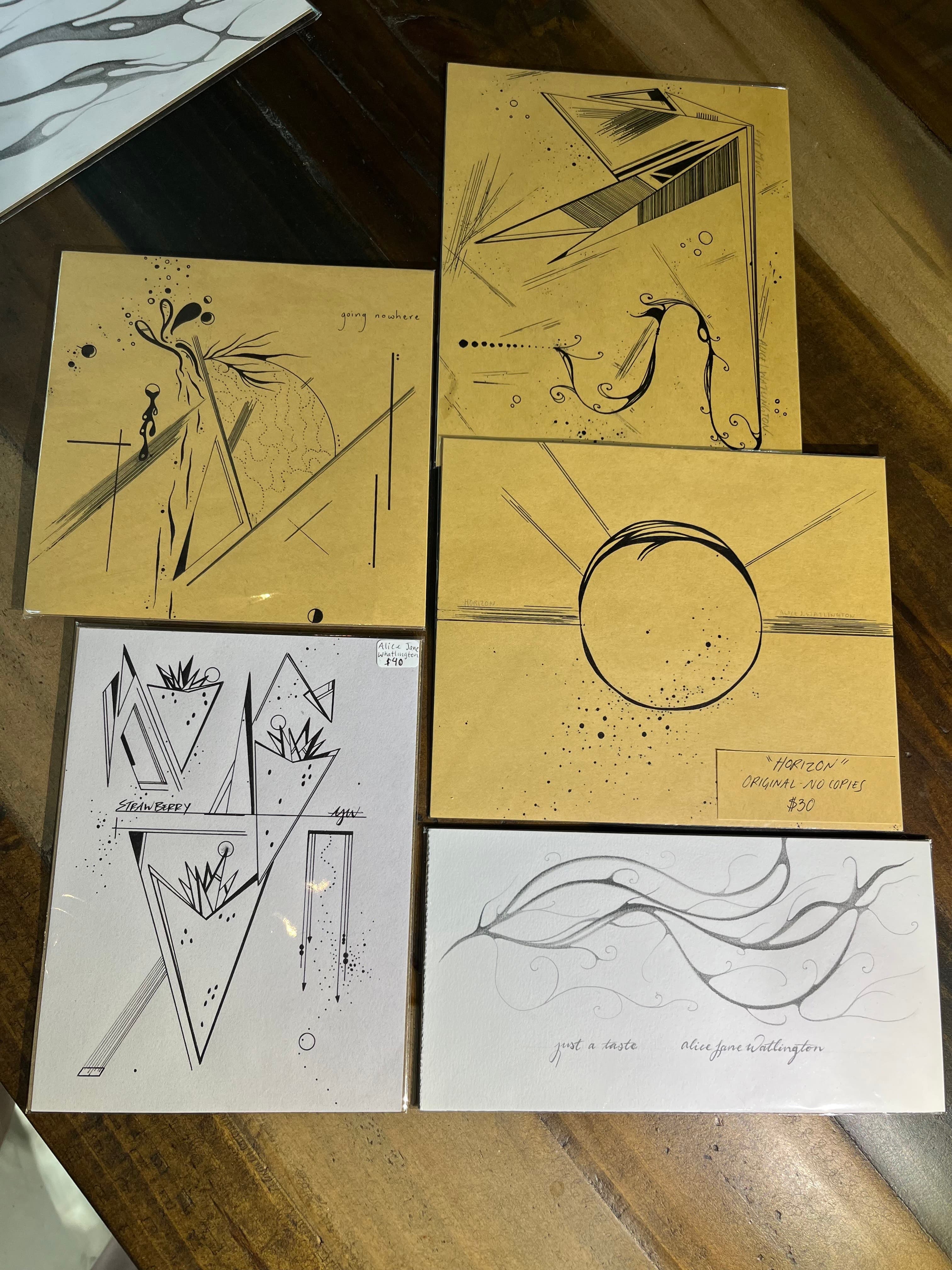 A collection of artistic postcards featuring abstract designs on textured backgrounds.