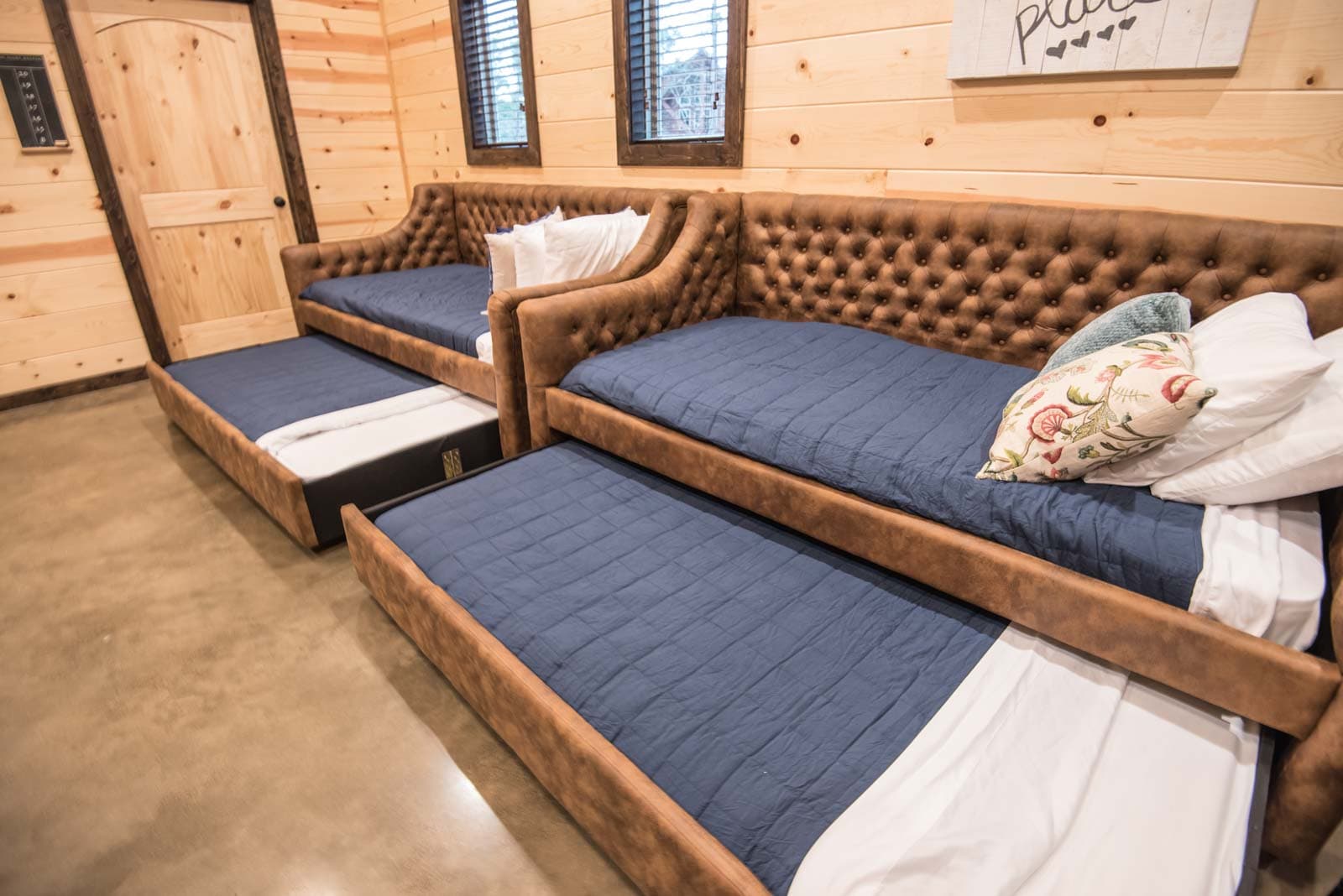 4 twin beds in game room