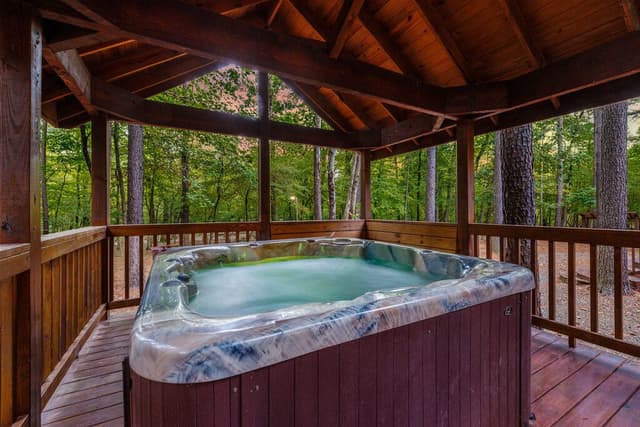 The hot tub at a Hochatown cabin to relax in after visiting the local distillery.