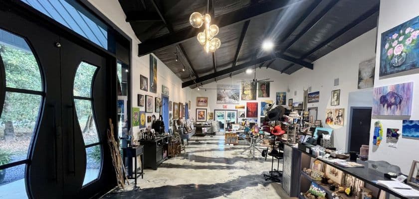 Gallery 259 in Broken Bow, Ok with art lining the walls.