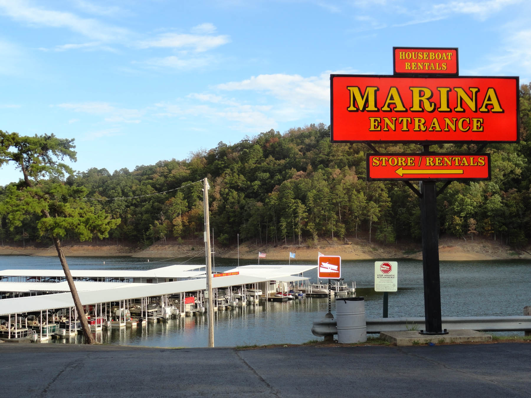 Sign for marina reading "Marina Entrance: Houseboat Rentals, Store/Rentals".
