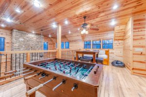 The game room of a Broken Bow cabin rental to stay at on family vacations in Oklahoma.