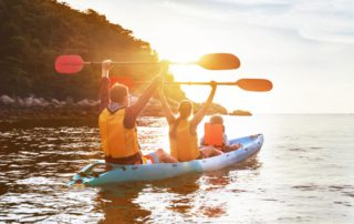 A family kayaking, a popular thing to do on summer vacations in Oklahoma.