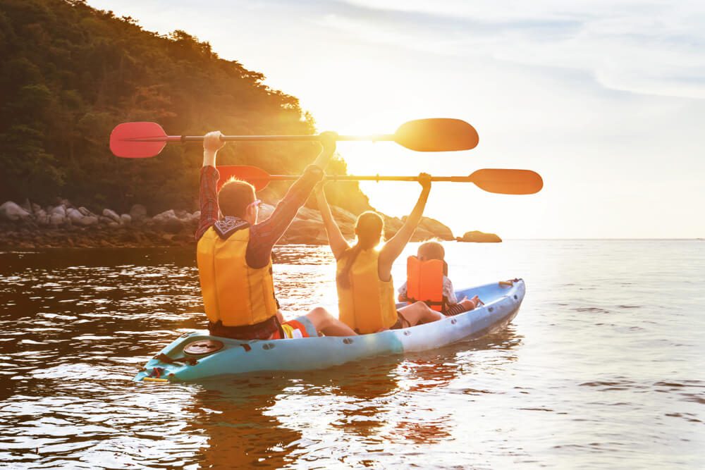 A family kayaking, a popular thing to do on summer vacations in Oklahoma.
