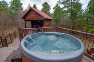 A hot tub out on the back deck of one of the cabins in Hochatown, Oklahoma.