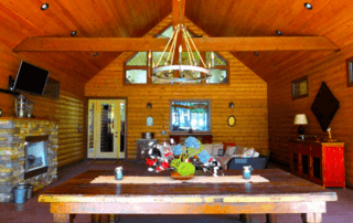 The dining and living room area of a Hochatown cabin to exchange gifts found shopping at local stores.