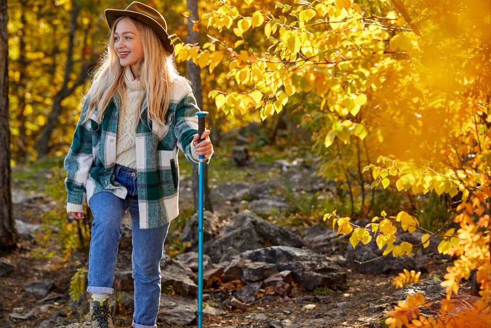 A woman hiking, one of the best things to do in Hochatown in the fall.